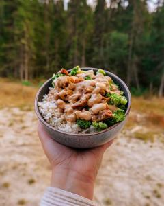 Peanut dressing rice bowl with trees in background