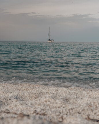 beach spot with sailor in sea. 